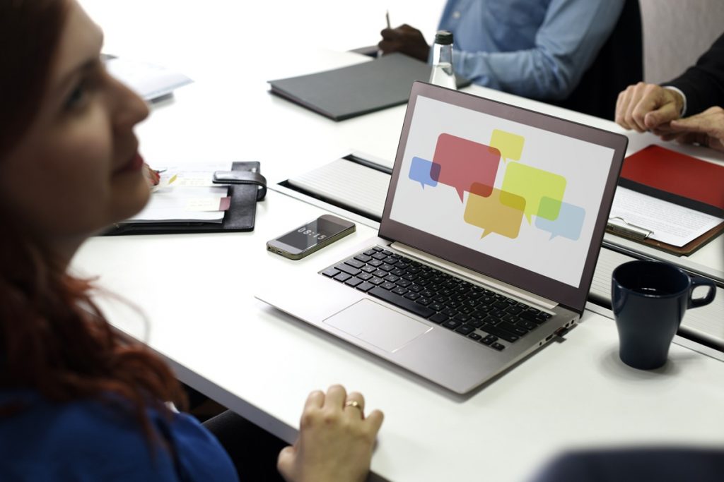 Small business owner using branding basics for communicating on laptop.