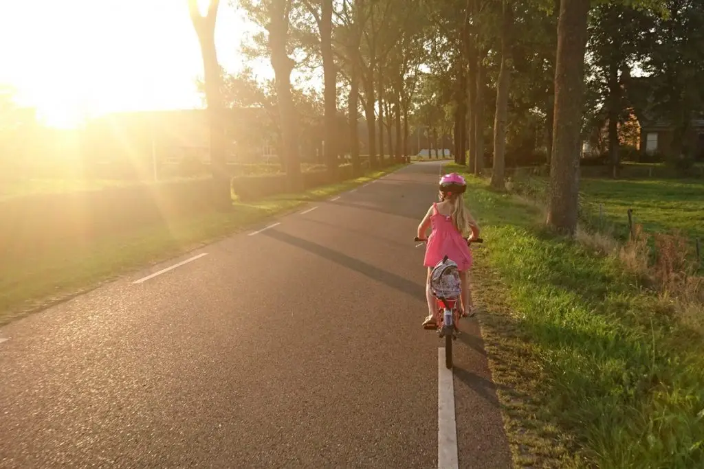Kid on bicycle during DST