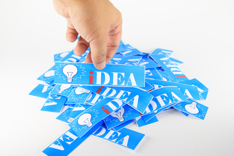 Hand selecting an idea while organizing a content workflow